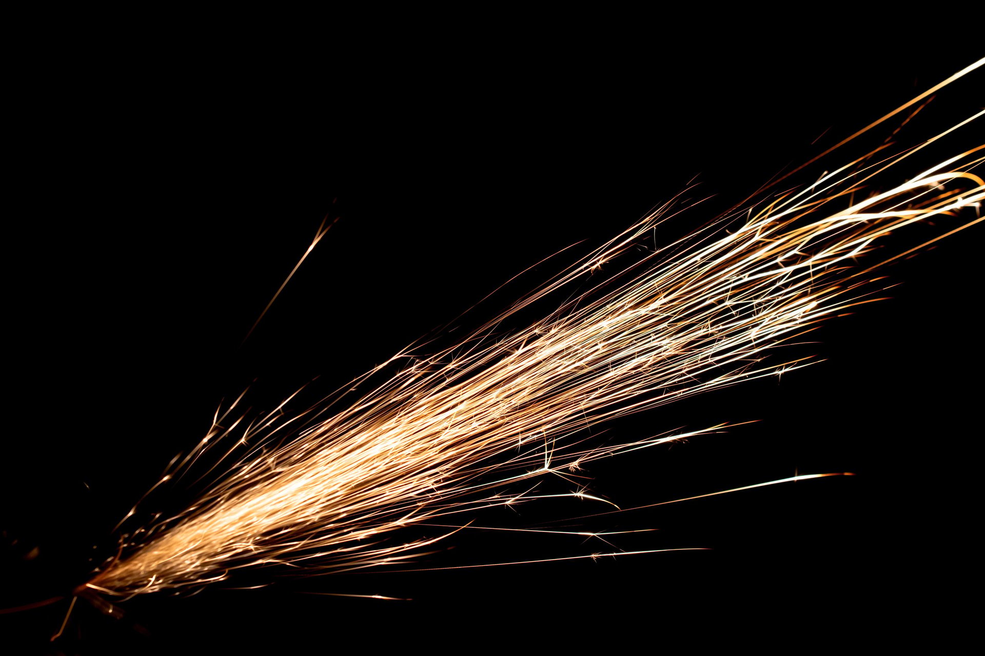 Sparks from the grinder glowing in the dark